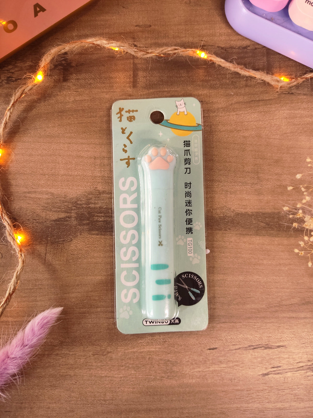 Ciseaux kawaii en forme de patte de chat vert avec capuchon pour la rentrée.