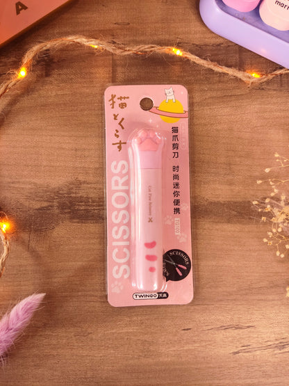 Ciseaux kawaii en forme de patte de chat rose avec capuchon pour la rentrée.