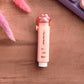 Gros plan sur la gomme kawaii patte de chat couleur orange.