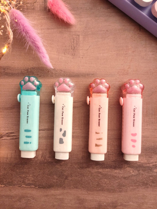 Gommes en forme de patte de chat roses, vertes, oranges et blanches pour la rentrée scolaire.