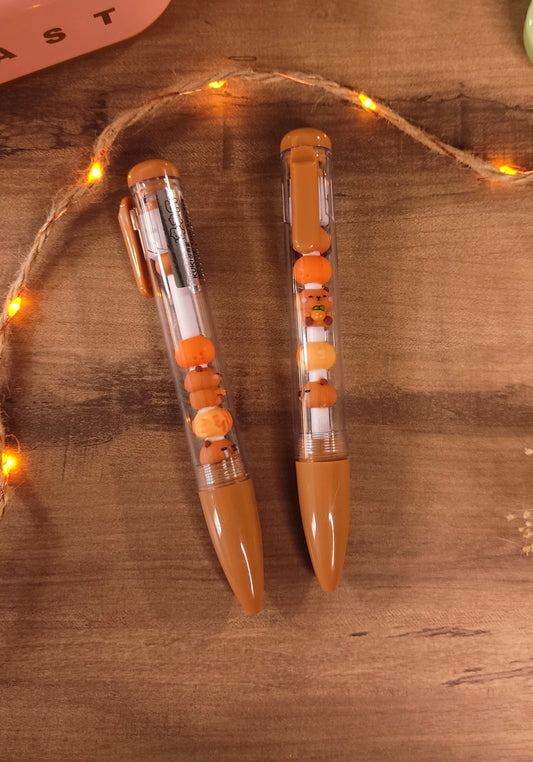 Stylo gel noir kawaii capybara avec figurines amovibles pour la rentrée des classes.